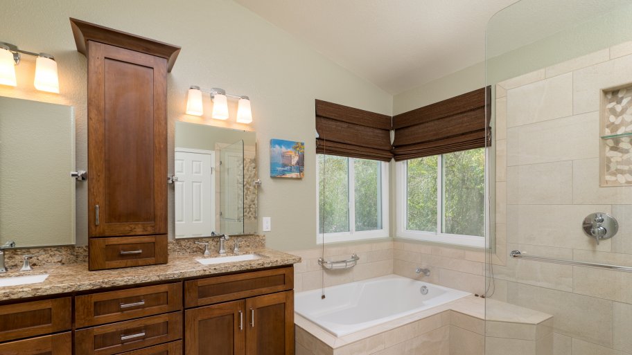 caramel chocolate vanity with granite top, his and hers sinks single handle fixtures